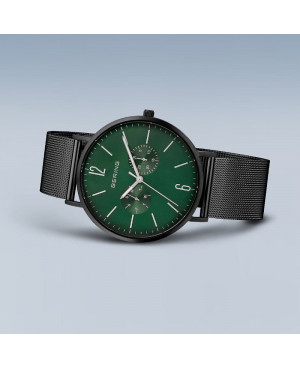 czarny zegarek z zieloną tarczą